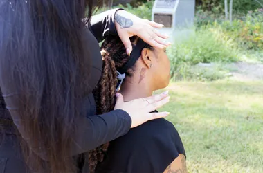 Dr. Amber Jones examining and adjusting a patient's neck